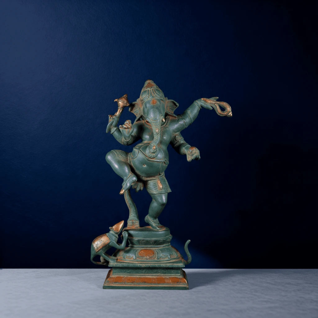 Front view of green patina Ganesha statue in dynamic dancing posture with detailed craftsmanship