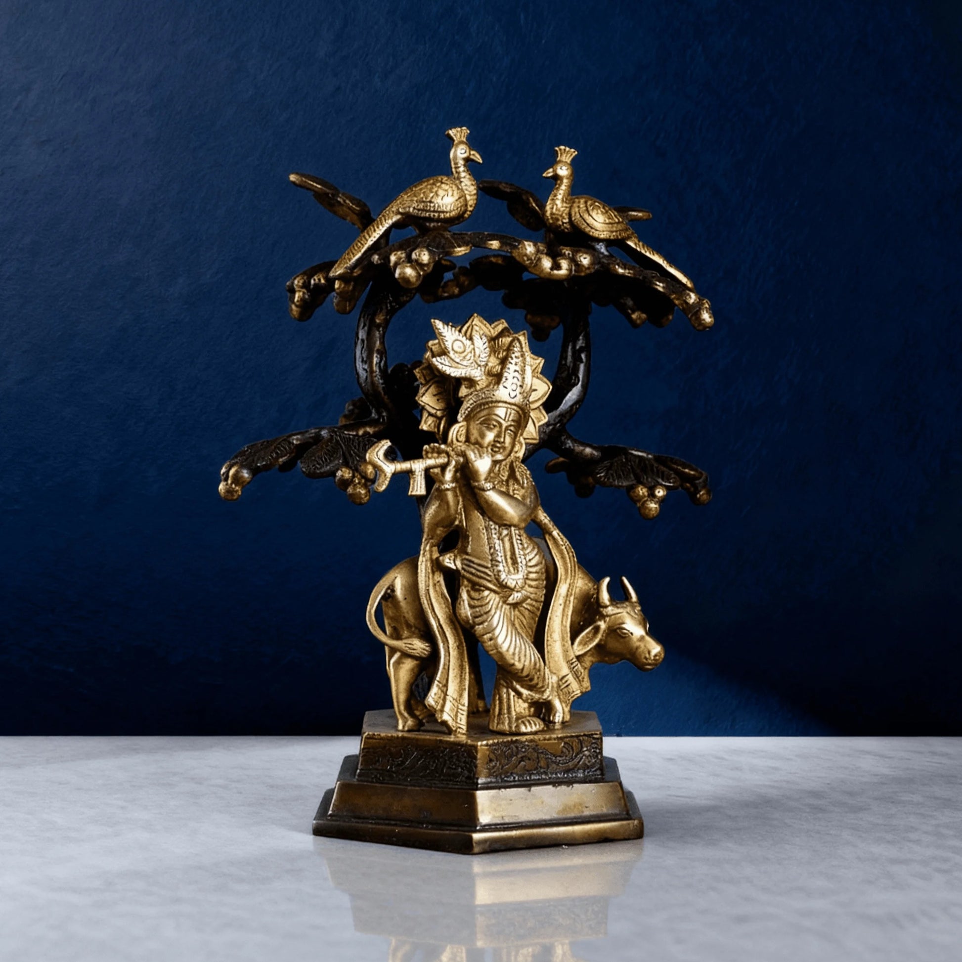Brass Krishna statue playing flute under tree with peacocks and cow – Hindu spiritual decor