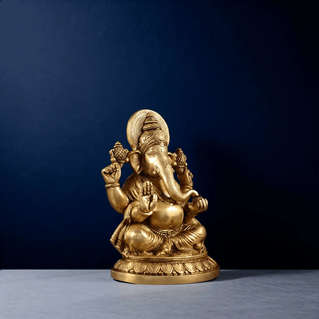 Three-fourth angle of brass Ganesha statue seated on decorative base for home decor and pooja room