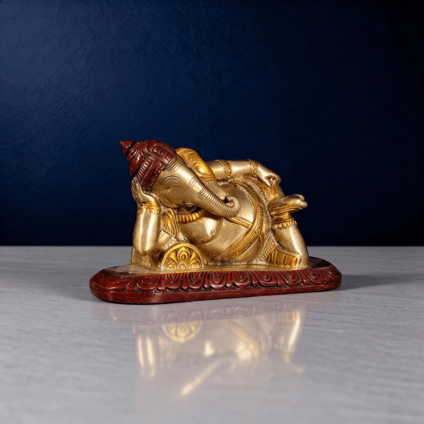 close up reclining ganesha brass statue for home decor