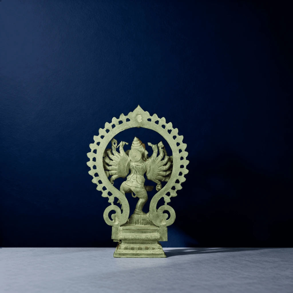 Rear view of multi-armed dancing Ganapati statue with antique green finish and arched frame design