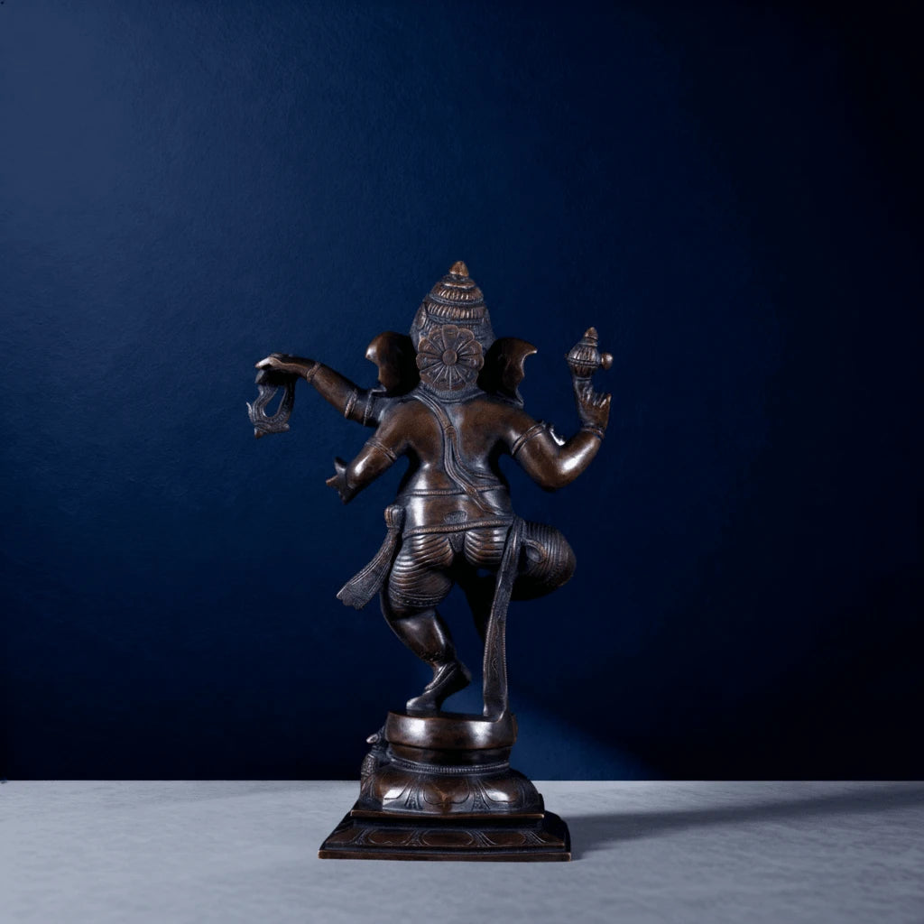 Rear view of bronze Ganapati dancing idol showing detailed back design and headgear