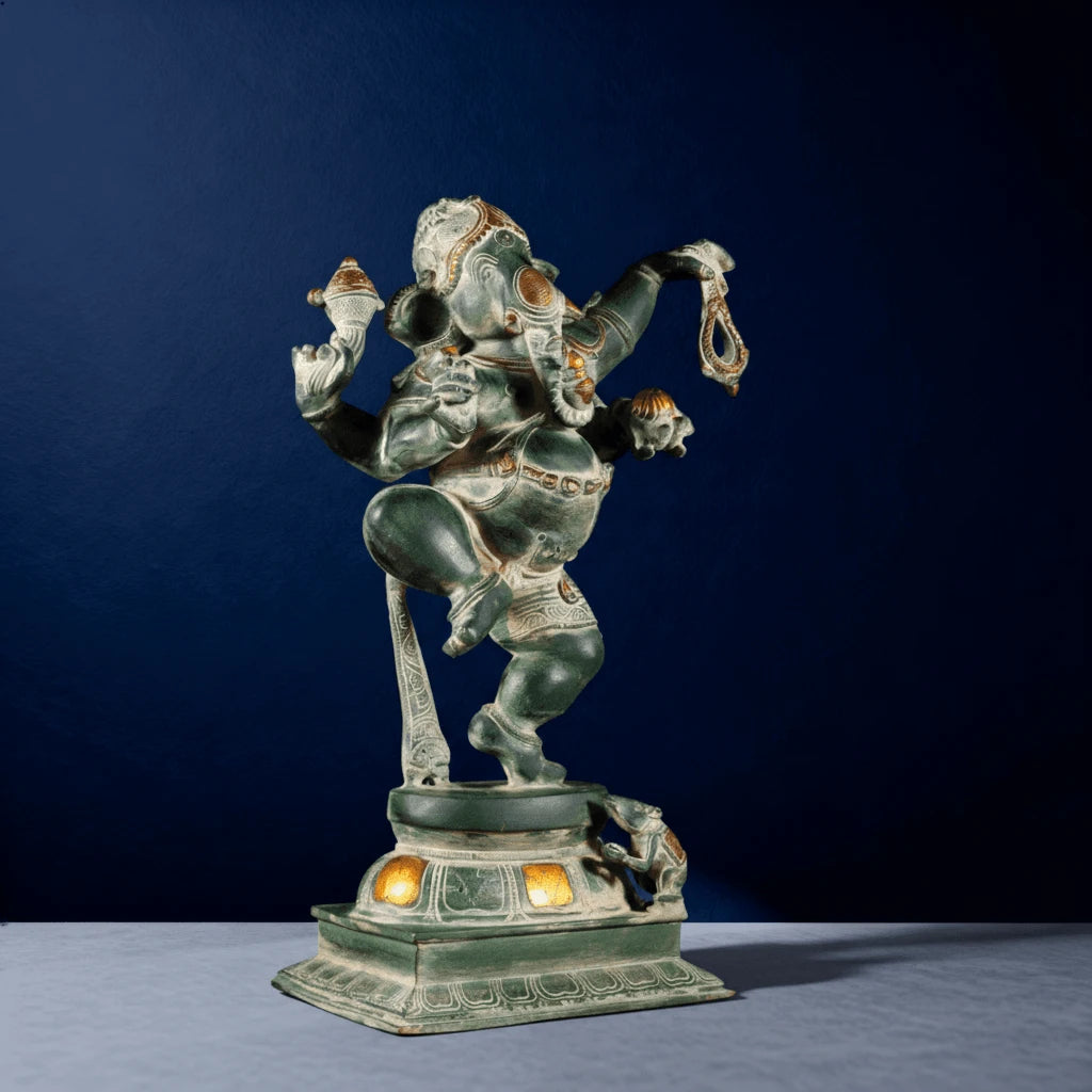 Angled close-up of oxidized dancing Ganesha idol with glowing yellow lights and intricate design