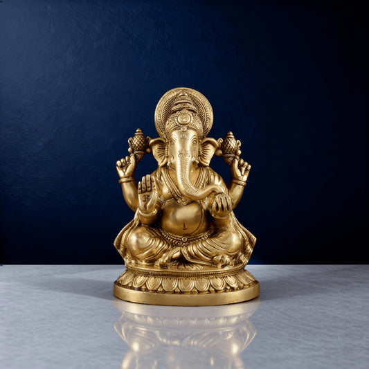 Full front shot of handcrafted brass Ganesha idol with ornate crown and lotus-style base in studio lighting