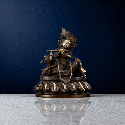 Front view of pure brass Krishna idol with cow, detailed base and crown, traditional handmade sculpture