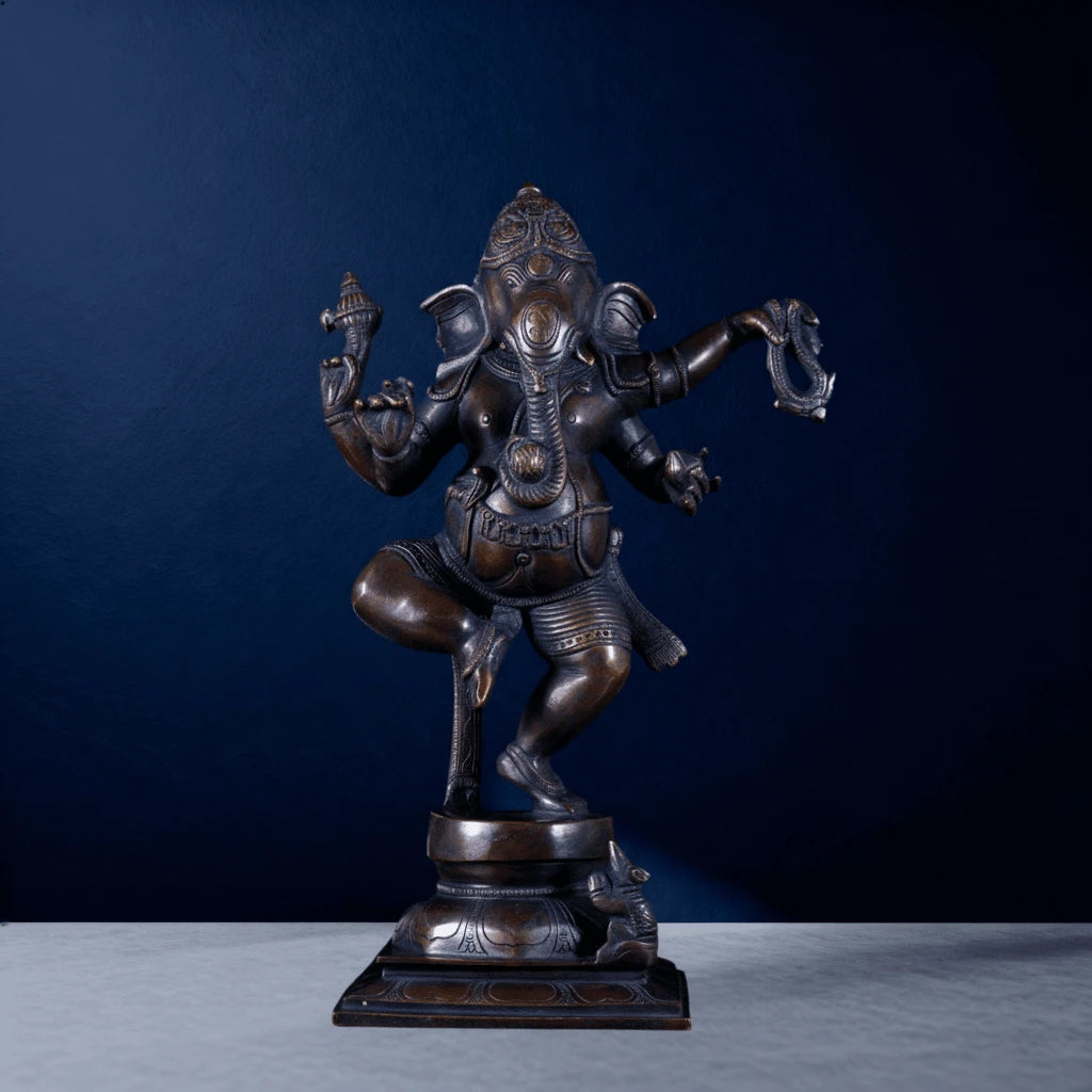 Front-facing bronze Nataraja Ganesha sculpture with four arms and raised leg on square base