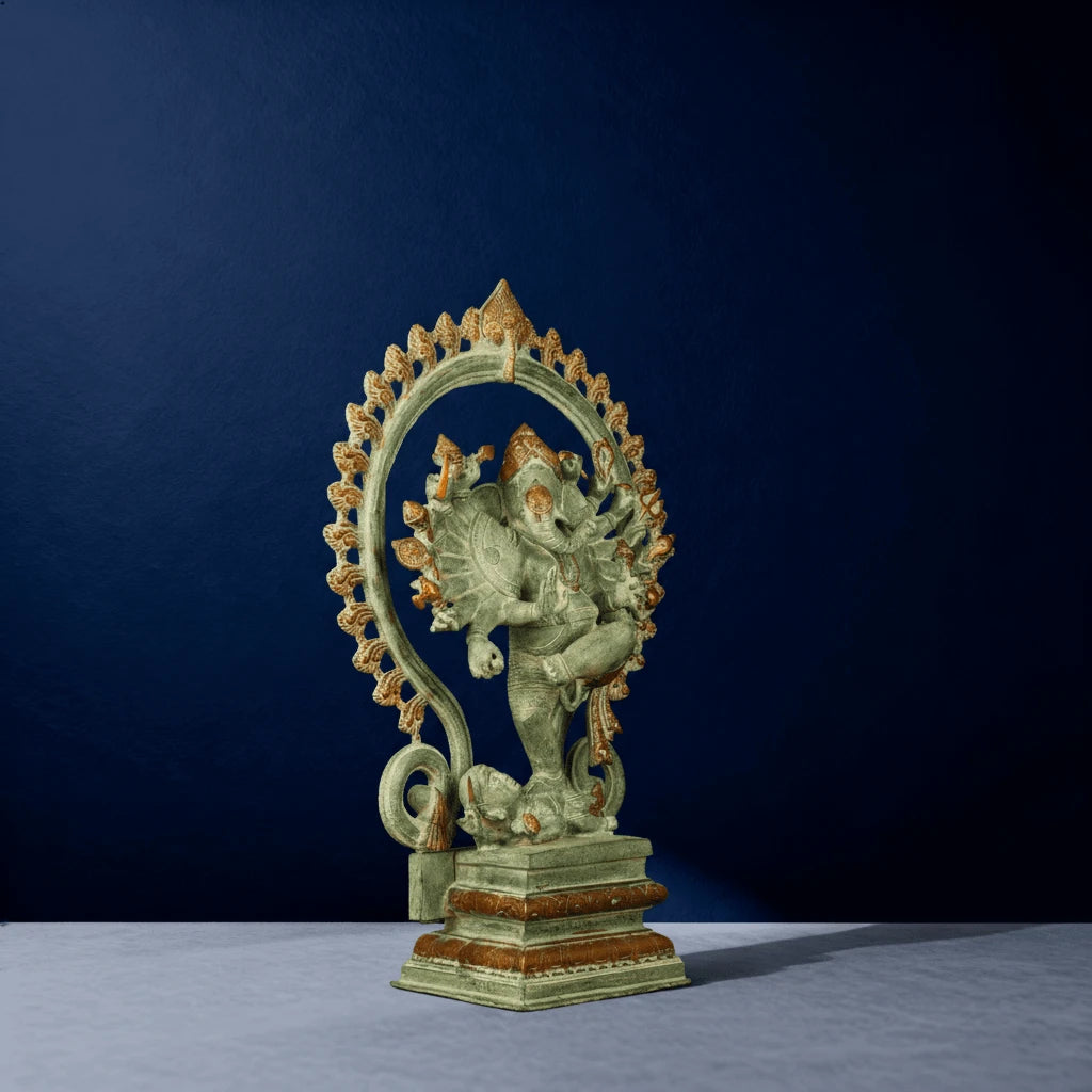 Angled side view of green oxidized multi-armed Ganesha dancing statue with golden arch halo
