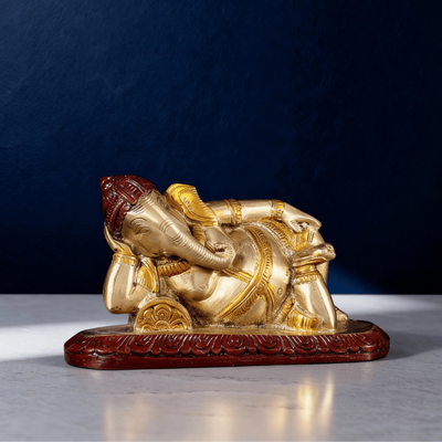 reclining brass ganesha statue with red base side view