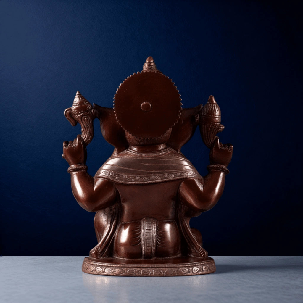 Back view of handcrafted brass Ganesha idol with detailed carvings and traditional finish for home decor